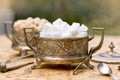 White and yellow sugar (cubes) in silver containers - antique bowls