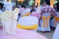 White yellow tissue paper in glass on table