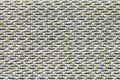 White and yellow vintage fabric with woven texture closeup. Textile macro background