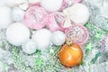 White and yellow xmas ornaments and Christmas balls on glitter h