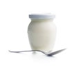 White yogurt in jar and spoon isolated on white background Royalty Free Stock Photo