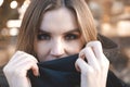 White young blonde woman with a black scarf on a background of lights Royalty Free Stock Photo