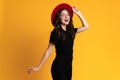 White young woman in red hat smiling while looking at camera Royalty Free Stock Photo
