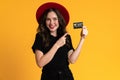 White young woman showing and pointing finger at her credit card Royalty Free Stock Photo