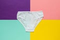 White youth panties on a multicolored background. Flat lay.