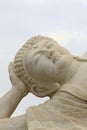 Face of a white Zen Buddha in close-up