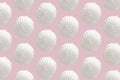 White zephyr marshmallows pattern on light pastel pink background Royalty Free Stock Photo