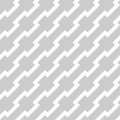 White zigzag lines in diagonal arrangement on grey background. Abstract background geometrical seamless pattern. Royalty Free Stock Photo