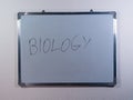 Whiteboard showing BIOLOGY concept on clean white wall background representing science education and life science learning Royalty Free Stock Photo