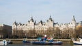 Whitehall Court seen from South Bank of London. Blue sky, some ships on the river. London, UK,