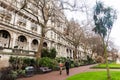 Scene from Whitehall Gardens, London, with couple walking in the park