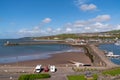 Whitehaven UK harbour walls with motorhomes and campervan parked near the Lake District