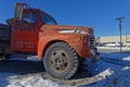 Old red truck as a decoration at the crossroad