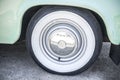 Whitewall tire mounted on restored 60s car Royalty Free Stock Photo