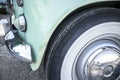 Whitewall tire mounted on restored 60s car Royalty Free Stock Photo