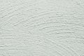 Whitewash lime textured grainy uneven background, wide brushstrokes in semi circle shape