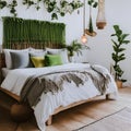 Whitewashed Boho: An airy bohemian-inspired bedroom with whitewashed walls, a macrame headboard, and an abundance of lush greene