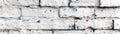 Whitewashed brick wall background with an aged distressed vintage rustic texture effect painted with a white vintage whitewash Royalty Free Stock Photo