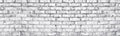 Whitewashed brick wall panoramic texture. White old brickwork long panorama. Widescreen light grey background Royalty Free Stock Photo