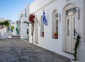 Whitewashed buildings cobblestone alley background at Sifnos island, Greece