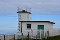 Whitewashed Coastguard Station Located Above the Irish Sea Royalty Free Stock Photo