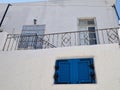 Whitewashed Home With Classic Blue Window Shutters on Paros, Greece Royalty Free Stock Photo