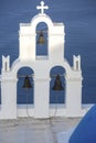 Whitewashed houses and blue dome church by the Aegean sea, Santoriniin Oia, Santorini, Greece. Famous blue domes in Oia village,