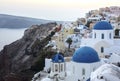 Whitewashed houses and blue dome church by the Aegean sea, Santoriniin Oia, Santorini, Greece. Famous blue domes in Oia village,