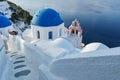 Whitewashed village, blue domes in Oia, Santorini Greece. mediterranean sea