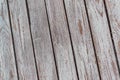 A whitewashed wooden surface worn out due to weather. Planks painted white. The texture of the wooden board Royalty Free Stock Photo