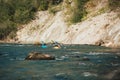 Whitewater kayaker paddling on river