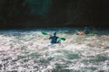 Whitewater kayaker paddling on river