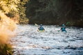 Whitewater kayaker paddling on river