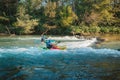 Whitewater kayaker paddling on river