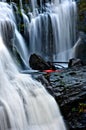 Whitewater kayaker preparing to paddle over a waterfall. Royalty Free Stock Photo