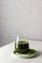 Whitgrass in a glass. Wheatgrass juice. healthy eating trend