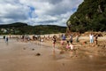 WHITIANGA, NZL - March 07 2016:Visitors making small hot water pools in Hot Water beach