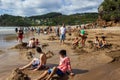 WHITIANGA, NZL - March 07 2016:Visitors making small hot water pools in Hot Water beach