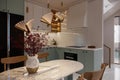 whitish and Polish colors used for the kitchen interior and Butterflies Lights hanging on Ceiling