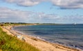 Whitley Bay beach and a lighthouse in a background in a summer day, England