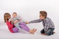 Who can play with the little brother? Siblings rivalry for the s Royalty Free Stock Photo