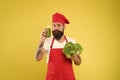 Who cares about diet. cook hold fresh salad and smoothie in bottle. organic eco vegan products. bearded man chef in Royalty Free Stock Photo