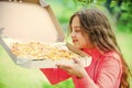Who cares about diet. her favorite food. junk food concept. happy child hold big pizza. meal delivery in time. hungry Royalty Free Stock Photo