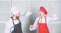 Who cook better. Culinary battle concept. Woman and bearded man culinary show competitors. Ultimate cooking challenge Royalty Free Stock Photo