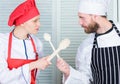 Who cook better. Ultimate cooking challenge. Culinary battle of two chefs. Couple compete in culinary arts. Kitchen Royalty Free Stock Photo