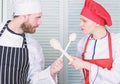 Who cook better. Ultimate cooking challenge. Culinary battle of two chefs. Couple compete in culinary arts. Kitchen Royalty Free Stock Photo