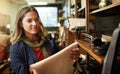 Who doesnt like leather. a young woman shopping in a leatherwork store.