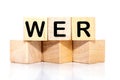 Who, German word for Who, (German: Wer) inscription on wooden cubes on a white background