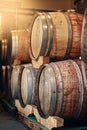 From those who know best. barrels of wine stacked on each other in a wine distillery. Royalty Free Stock Photo