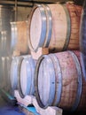 From those who know best. Shot of barrels of wine stacked on each other in a wine distillery. Royalty Free Stock Photo